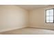 Cozy bedroom with plush carpet, neutral walls, and a window for natural light at 8092 Abington Way, Zionsville, IN 46077