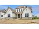 View of the home's front exterior with a combination of siding and stone work at 8092 Abington Way, Zionsville, IN 46077