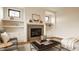 Elegant living room with a fireplace, built-in shelves, and comfortable seating at 8092 Abington Way, Zionsville, IN 46077