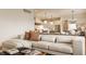 Open-concept living space with a view into the kitchen and dining area at 8092 Abington Way, Zionsville, IN 46077