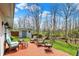 Outdoor patio with seating, and view of the shed, playset, and yard at 8110 Madrone Ct, Indianapolis, IN 46236