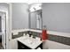 Modern bathroom featuring a vanity with a sink, mirror, and tiling at 8110 Madrone Ct, Indianapolis, IN 46236