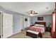 Comfortable bedroom featuring a ceiling fan and stylish decor at 8110 Madrone Ct, Indianapolis, IN 46236
