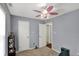 Bedroom with a ceiling fan, overhead lighting, and neutral walls at 8110 Madrone Ct, Indianapolis, IN 46236