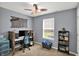 This bedroom is furnished with a desk, chair, and bookcase at 8110 Madrone Ct, Indianapolis, IN 46236