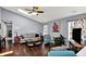 Cozy living room featuring hardwood floors, comfortable seating, and plenty of natural light at 8110 Madrone Ct, Indianapolis, IN 46236