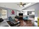 Bright and spacious living room with hardwood floors, skylight, modern furnishings, and an open layout at 8110 Madrone Ct, Indianapolis, IN 46236