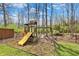 Fun backyard playset area with a slide, swing, and climbing structure at 8110 Madrone Ct, Indianapolis, IN 46236