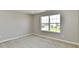 This bedroom offers a big window and plush carpeting at 8163 Dewberry Ln, Pendleton, IN 46064