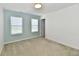 This bedroom offers plenty of light, paint accent and carpeting at 8163 Dewberry Ln, Pendleton, IN 46064