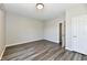 Bedroom features hardwood floors and a white door at 8163 Dewberry Ln, Pendleton, IN 46064
