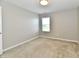Bright bedroom features neutral carpeting, fresh paint, and a window for natural light at 8163 Dewberry Ln, Pendleton, IN 46064
