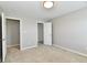 Bedroom showing closets and neutral carpeting, offering a blank canvas to personalize at 8163 Dewberry Ln, Pendleton, IN 46064