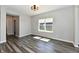 Well-lit bedroom featuring hardwood floors, a large window and a spacious layout at 8163 Dewberry Ln, Pendleton, IN 46064