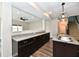 Kitchen with granite countertops, stainless sink, wood floors and an open view to the living room at 8163 Dewberry Ln, Pendleton, IN 46064