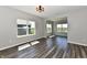 Bright living room featuring wood floors, modern lighting, and views of the community at 8163 Dewberry Ln, Pendleton, IN 46064