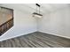Open-concept living room features hardwood floors and a modern light fixture at 8163 Dewberry Ln, Pendleton, IN 46064