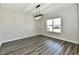 Well-lit living room features hardwood floors and a modern light fixture at 8163 Dewberry Ln, Pendleton, IN 46064