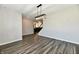 Bright living room features hardwood floors and a modern light fixture at 8163 Dewberry Ln, Pendleton, IN 46064