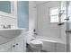 Bathroom featuring white subway tiles, a tiled shower/tub, and modern fixtures at 819 E Mills Ave, Indianapolis, IN 46227