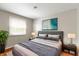 A well-decorated bedroom features a comfortable bed, soft lighting and accents at 819 E Mills Ave, Indianapolis, IN 46227