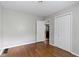 Bedroom features hardwood floors, neutral walls and a closet for storage at 819 E Mills Ave, Indianapolis, IN 46227