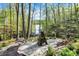 Beautiful backyard with access to the lake, wooden walkway, fire pit and chairs for relaxing at 8191 S Bayview Ct, Trafalgar, IN 46181