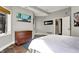 Bedroom features a window, dresser, artwork, and stone flooring, adjacent to a doorway at 8191 S Bayview Ct, Trafalgar, IN 46181