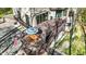 A multi-tiered deck with an outdoor dining set and lounge area offers ample entertaining space at 8191 S Bayview Ct, Trafalgar, IN 46181