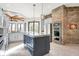 Spacious kitchen features a brick accent wall, granite countertops, stainless steel appliances at 8191 S Bayview Ct, Trafalgar, IN 46181