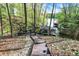 Scenic lake view captures the serene waterfront, wood stairs and the dock at 8191 S Bayview Ct, Trafalgar, IN 46181