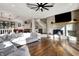 Bright and spacious living room featuring hardwood floors, a fireplace, and comfortable seating at 8191 S Bayview Ct, Trafalgar, IN 46181