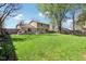 Expansive backyard with a well-maintained lawn and ample space for activities at 8332 Tanager Ln, Indianapolis, IN 46256