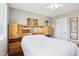 Comfortable bedroom featuring a ceiling fan, windows, and beautiful wooden furniture at 8332 Tanager Ln, Indianapolis, IN 46256