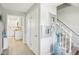 Bright entryway featuring hardwood floors, white trim, and a view into the adjacent kitchen area at 8332 Tanager Ln, Indianapolis, IN 46256