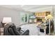 Comfortable living room with stone fireplace, neutral walls, and a view to the backyard at 8332 Tanager Ln, Indianapolis, IN 46256