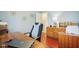 Bright home office featuring hardwood floors, a desk, and a comfortable chair at 8332 Tanager Ln, Indianapolis, IN 46256