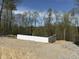 A newly constructed foundation on a wooded lot, ready for building a custom home at 8448 E Dobbs Cemetary Rd, Columbus, IN 47201