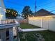Spacious backyard with deck, string lights, and detached garage at 926 Olive St, Indianapolis, IN 46203