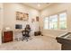Bright bedroom with a large window, desk setup, musical instruments, and neutral carpeting at 926 Olive St, Indianapolis, IN 46203