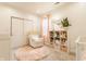Cozy Bedroom with a comfortable rocking chair, a soft rug, and plenty of storage for a peaceful retreat at 926 Olive St, Indianapolis, IN 46203
