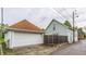 View of the detached garage and side of the home at 926 Olive St, Indianapolis, IN 46203