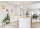 A well-appointed kitchen island featuring a sink, stylish pendant lights, and a clear view of adjacent dining area at 926 Olive St, Indianapolis, IN 46203