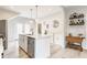 Stylish kitchen island with a sink, stainless steel dishwasher, and pendant lighting create a modern, functional space at 926 Olive St, Indianapolis, IN 46203