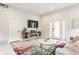 Bright living room with comfortable seating, a stylish rug, and ample natural light at 926 Olive St, Indianapolis, IN 46203