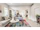 Open-concept living room with comfortable seating and seamless flow to the dining area at 926 Olive St, Indianapolis, IN 46203