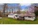 Overhead view of backyard, detached garage, and mature trees at 9570 S 300 W, Columbus, IN 47201