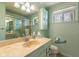 Bright bathroom features a vanity with sink, a toilet, and a shower/tub combination at 9570 S 300 W, Columbus, IN 47201