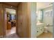 Bathroom featuring a single sink and an office space visible through the door at 9570 S 300 W, Columbus, IN 47201