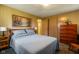 Cozy bedroom features a comfortable bed, wooden dresser, and ample closet space at 9570 S 300 W, Columbus, IN 47201